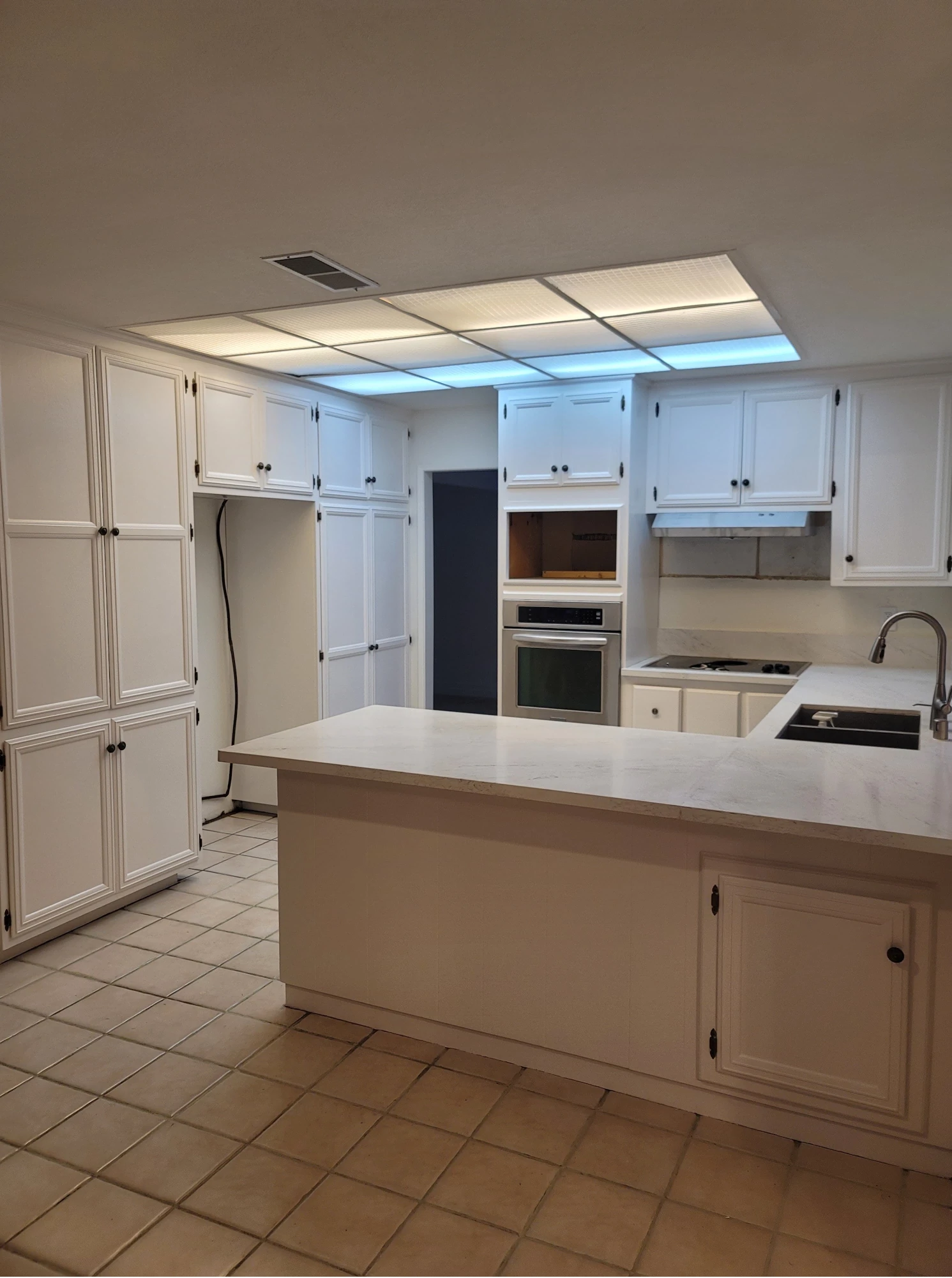 Kitchen cabinets after refinishing - View 1